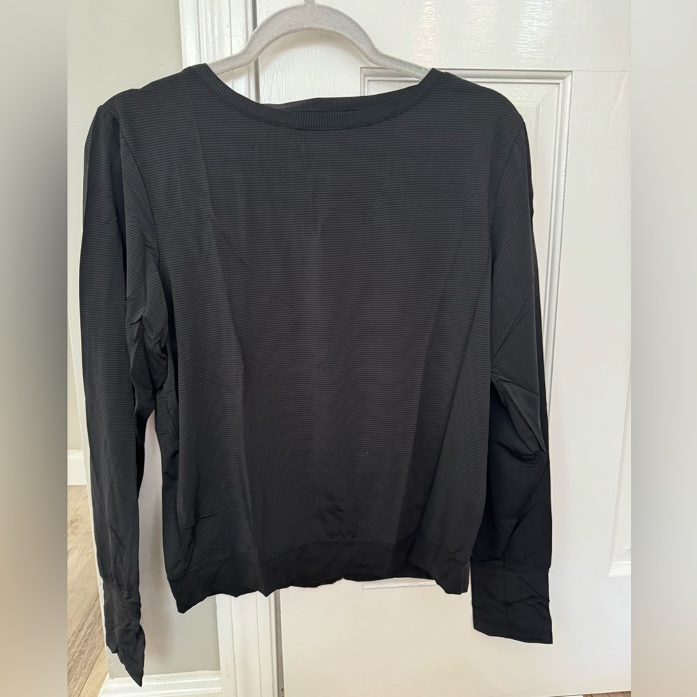 Zyia, black long sleeve t. Mesh on the top/back, open lower back. Size medium